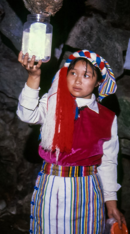 Nu woman collects water from the 'breast' of A-Rong