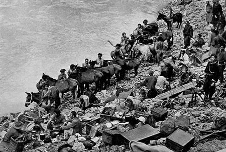 Rock's entourage preparing to cross the Yangtze on inflated goat skins