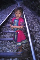 A Miao girl on the train tracks (MH)