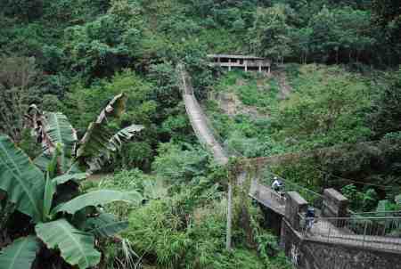 Cycling across the suspension bridge at Lahadi (MH)
