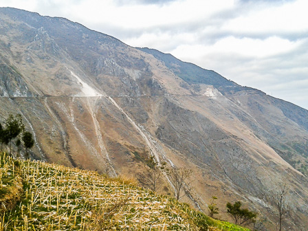 Erosion and debris from mining along the road to Tangdan