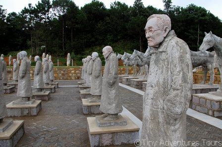 A completed part of the Songshan monument. There are 84 soldiers still alive today who fought in the battle and they are depicted in their present-day appearances.