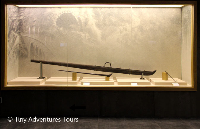 Display case with three crowbars ranging from giant to standard to piccolo