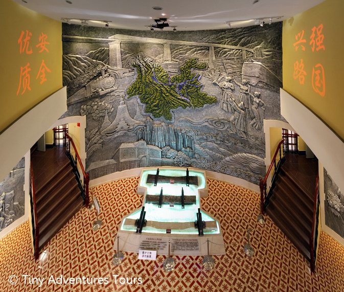 A large mural depicting the different rolling stock used in Yunnan, with actual examples below