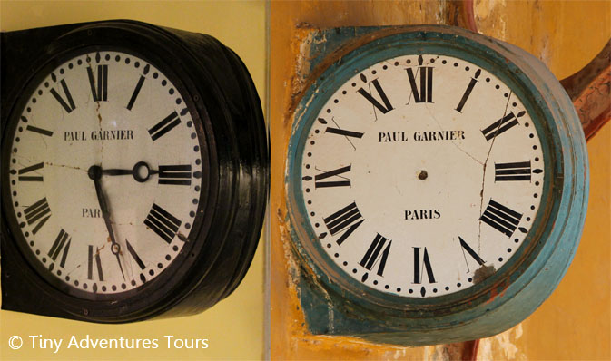 Paul Garnier electrical clocks made in Paris. On the left is a clock displayed in the museum. On the right is the single remaining one at Beshizhai Station, minus its hands
