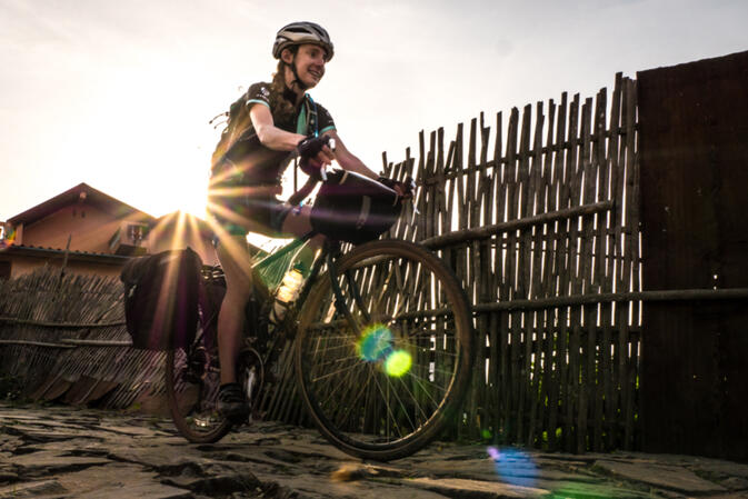 Riding through the old town of Phongsali, one of only a few old towns in Laos undamaged by bombing during the Vietnam War (photo credit: Will Stauffer-Norris)