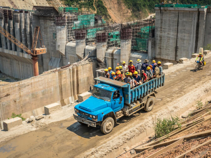 Kyle rides past the site of Nam Ou #5, a major hydropower project on the currently free-flowing Nam Ou River (photo credit: Will Stauffer-Norris)