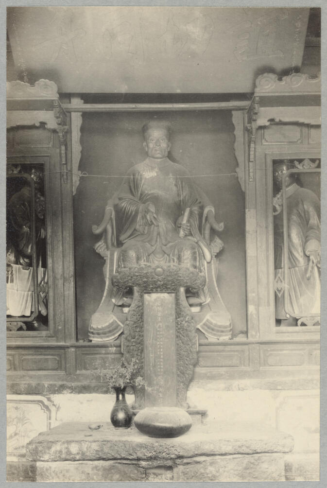 Statue of seated general behind altar April 15, 1922