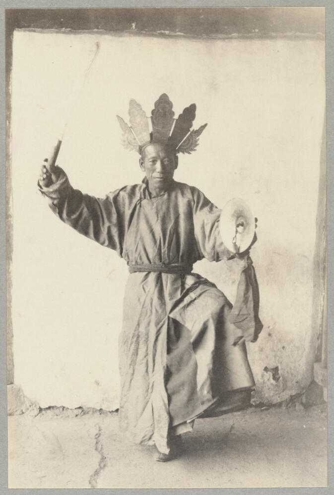 Man in native dress performing religious dance September 1922