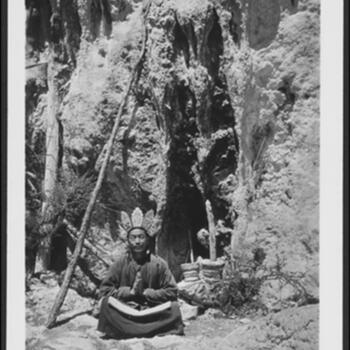 Naxi dto-mba reciting from the book Shi-lo ssaw at the sacred grotto Shi-lo ne-k'o on a mountain in the Bber-dder District in northwest Yunnan Undated