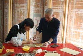 Yang Liqun of the National Ancient Texts Restoration Center teaches a preservation volunteer