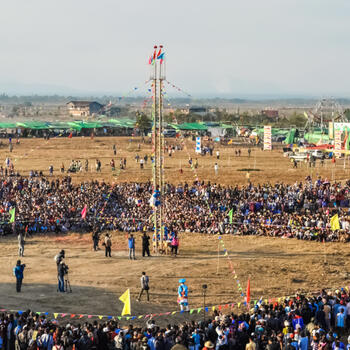 A man ascends the intimidating sword ladder in at Kuoshi Festival in Putao, Myanmar