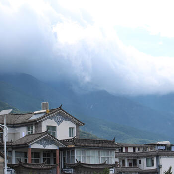 Clouds roll down the slopes of Cangshan Mountain in Dali