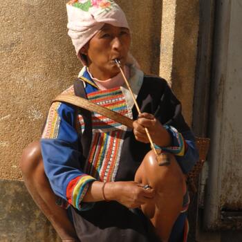 Lahu woman smoking a pipe in Lincang Prefecture, Yunnan