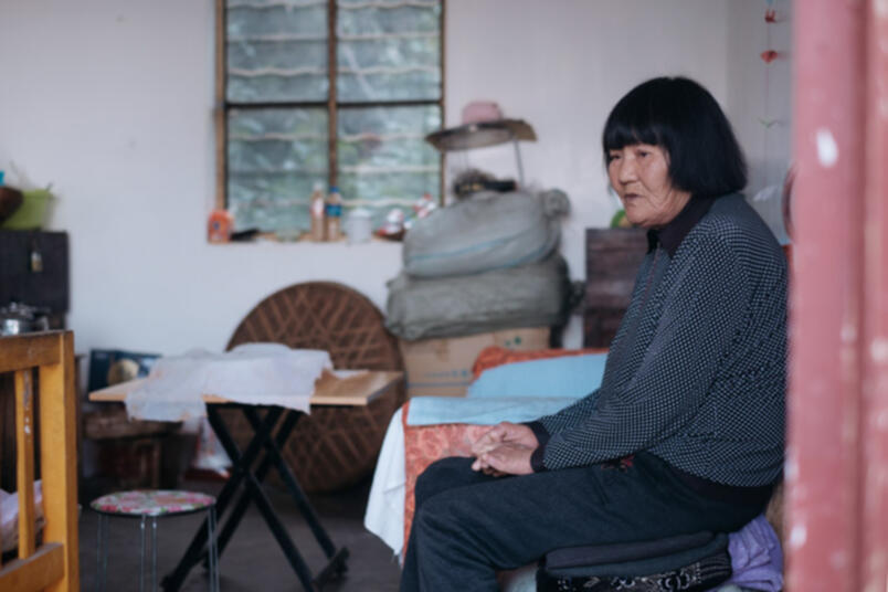 Tao Linxian poses for a photo at her house in Luoxianguan Village, Yunnan province, March 25, 2019 (Image credit: Wu Huiyuan/Sixth Tone)