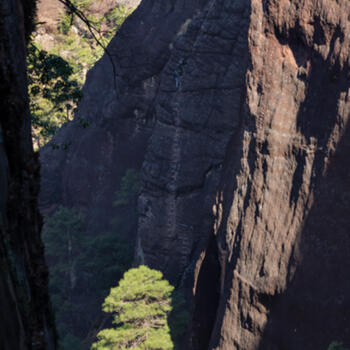 Look closely for climbers on this via ferrata on the Anqini Trail