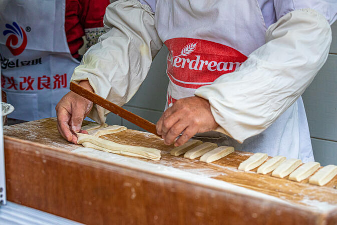 Chef is making dough sticks