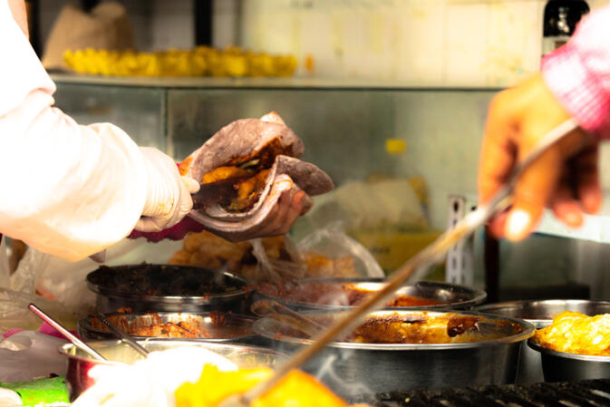 Shao er kuai made with red rice, rolled with deep fried dough stick and all kinds of paste