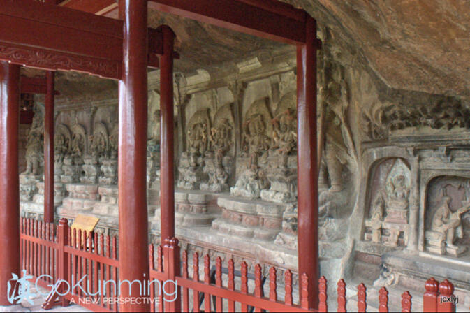 The grotto depicting Buddha surrounded by three-headed, six-armed bodisattvas