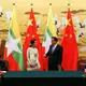 Delayed dam, rebel groups dominate Suu Kyi's China visit